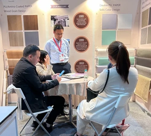Talking with furniture customer in MIFF 2025
