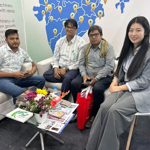 Nina & customers talking business in India Wood